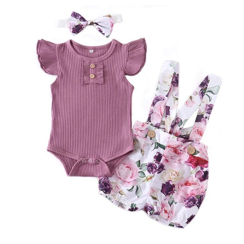 Babyflicka Lila Bodysuit och Blommönstrade Hängselshorts